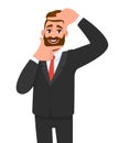 Trendy bearded young businessman making frame gesture with hands and fingers. Hipster person showing or framing his face.