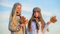 Trendy beauty. small girls with curly hair. children friends autumn leaf. stylish sisters in fall beret. autumn trends