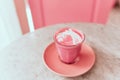 Trendy beetroot latte with latte art and flower petals Royalty Free Stock Photo