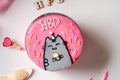 Trendy bento cake in pink color with cute decor on a light background