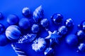 Trendy blue monochrome Christmas background. Ball Christmas toy Open composition. Color of the year 2020