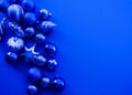 Trendy blue monochrome Christmas background. Ball Christmas toy Open composition. Color of the year 2020