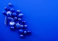 Trendy blue monochrome Christmas background. Ball Christmas toy Open composition. Color of the year 2020