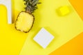 Trendy bright yellow background with geometric forms and podiums for product presentation. Pineapple and podiums to show products