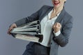 Trendy business owner woman rejoicing isolated on gray Royalty Free Stock Photo