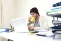 Trendy businessman in cool hipster beanie drinking coffee working in at modern home office with computer Royalty Free Stock Photo