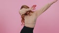 Trendy businesswoman girl in blouse having fun dancing and moving to rhythm, dabbing raising hands Royalty Free Stock Photo