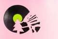 Trendy Christmas concept made of broken green label vinyl record on pink background with copy space. Creative retro music Royalty Free Stock Photo