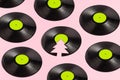 Trendy Christmas pattern made of broken green label vinyl record on pink background with copy space. Creative retro music Royalty Free Stock Photo