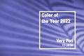 Trendy Color of year 2022 presentation. Shadow of palm leaf on violet background