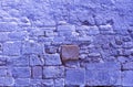 Trendy Color of the year 2022 Very Peri. Brick background grunge texture. Stone lilac brick wall. Wall of an old ruined brick Royalty Free Stock Photo