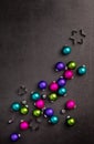 Trendy and colourful Neon Christmas Ornaments Scattered. Top view, flat lay with copyspace Royalty Free Stock Photo