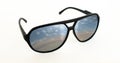 Trendy cool black sunglasses with the reflection of a beautiful sunset over an ocean Royalty Free Stock Photo