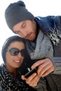 Trendy couple using mobile