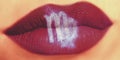 Trendy Creative lip makeup. Closeup Shiny glossy lips with Virgo