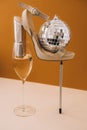 Trendy creative photo of Champagne glass with white wine and high heels in a modern balancing composition. Holiday party concept. Royalty Free Stock Photo