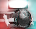 Trendy 3d Anaglyph Effect: Teenager Playing A Computer Game At Home Wearing A Headset