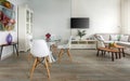 Trendy designed dining and living rooms in white lagom Scandinavian style. Elegant contemporary loft concept Royalty Free Stock Photo