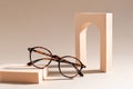 Trendy Eyeglass frame on beige Background, trendy Still Life Style. Tortoiseshell frame glasses. Optic store advertisement
