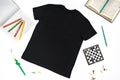 Trendy fashion T-shirt black styled basic clothes and accessories collection on white background. Flat lay, top view. Chess, book