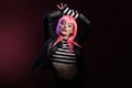 Trendy female rocker with natural leather jacket and pink wig Royalty Free Stock Photo