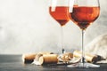 Trendy food and drink, orange wine in glass, gray table background, space for text, selective focus, vintage toned image