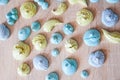 Trendy french cookies flat lay. meringue top view background. sea shell dessert. green and blue color candy. whipped egg white swe Royalty Free Stock Photo
