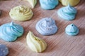 Trendy french cookies flat lay. meringue top view background. sea shell dessert. green and blue color candy. whipped egg white swe Royalty Free Stock Photo