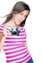 Trendy and funny young girl holding a compact camera Royalty Free Stock Photo