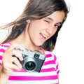 Trendy and funny young girl holding a compact camera Royalty Free Stock Photo