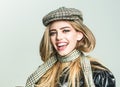 Trendy girl with makeup on sensual face. Autumn fashion for woman in hat and scarf. woman with stylish long hair in Royalty Free Stock Photo