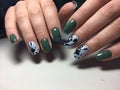 Trendy green manicure on a textural