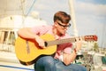 Trendy guy with guitar outdoor Royalty Free Stock Photo