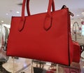 Trendy handbag on transparent display