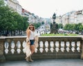 Trendy hippie woman tourist walking on Wenceslas Square, Prague Royalty Free Stock Photo