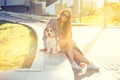 Trendy Hipster Fashion Girl with Dog in the City Royalty Free Stock Photo