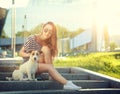 Trendy Hipster Girl with her Dog in the City Royalty Free Stock Photo