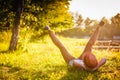 Trendy Hipster Girl Relaxing on the Grass Royalty Free Stock Photo