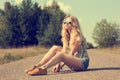 Trendy Hipster Girl Sitting on the Road