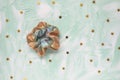 Trendy holographic scrunchie and stars on green