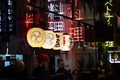 Trendy interior of asian restaurant decorated with chinese lanterns neon signs of hieroglyphs