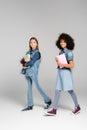 trendy interracial schoolgirls in denim clothes