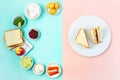 Trendy Korean sandwich inkigayo with ingredients on two-color pastel background, top view, horizontal Royalty Free Stock Photo