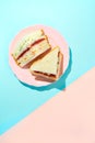 Trendy Korean sandwich inkigayo on two-color pastel background, top view, vertical orientation Royalty Free Stock Photo