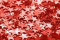 Trendy living coral star shaped festive confetti background