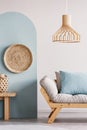 Trendy living room interior with white and blue wall and comfortable couch Royalty Free Stock Photo