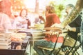 Trendy man cooking cobs of the corn at vegetarian barbecue dinner outdoor - Chef grilling vegan food for bbq meal - Healthy Royalty Free Stock Photo