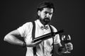 trendy man in suspenders and bow tie with wine. confident elegant man drinking wine. alcoholic drink. stylish sommelier Royalty Free Stock Photo