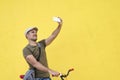 Trendy man taking a selfie with his fixed bike Royalty Free Stock Photo