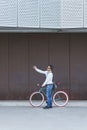 Trendy man taking a selfie with his fixed bike Royalty Free Stock Photo